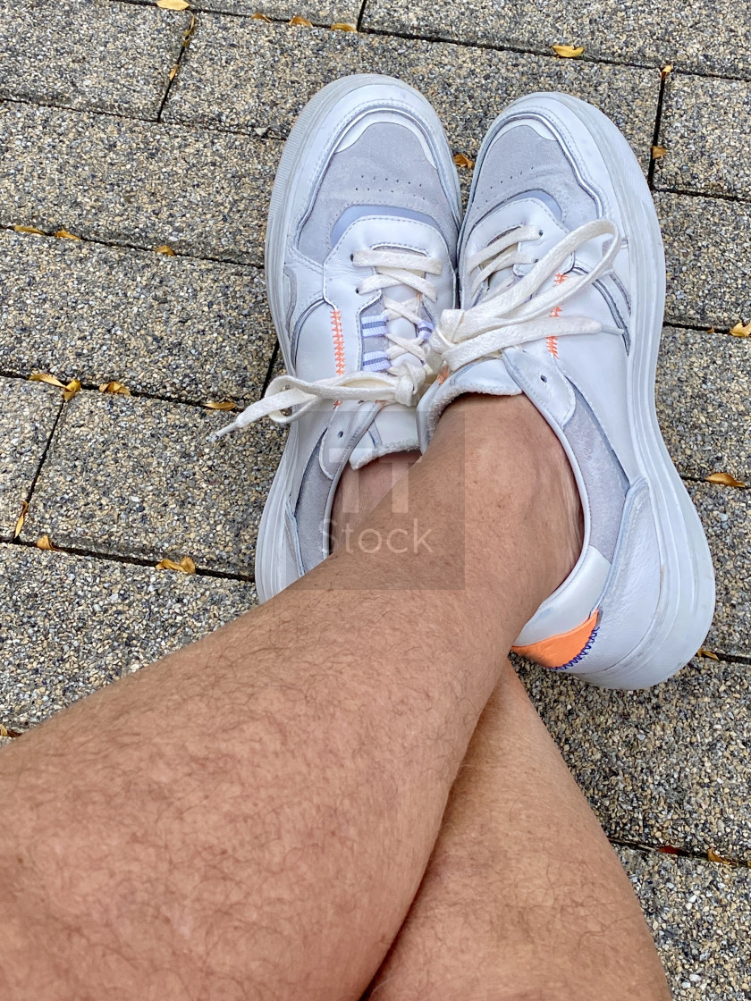 "Close-up selfie of man's legs." stock image