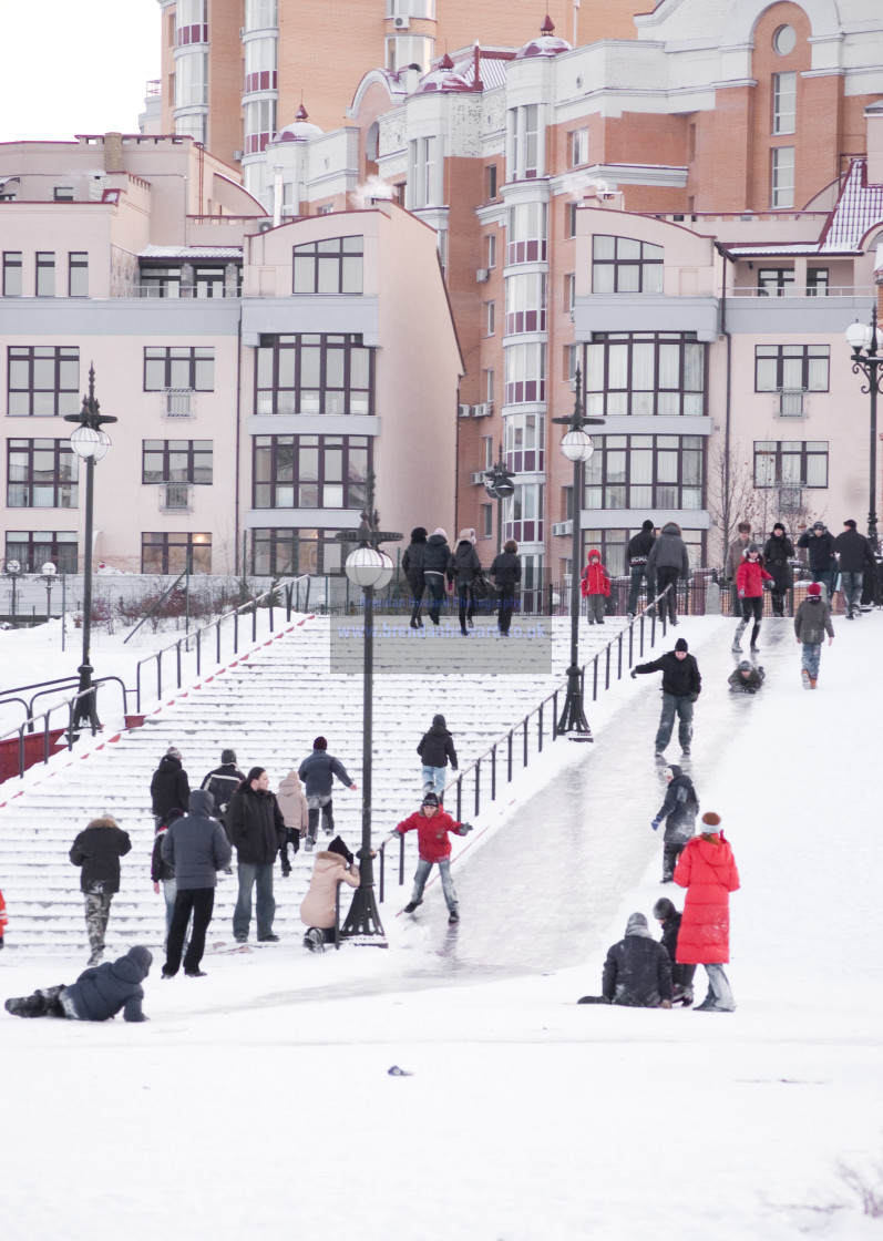 "Children Sliding Down Icy Slope in Obolon, Kyiv, Ukraine" stock image