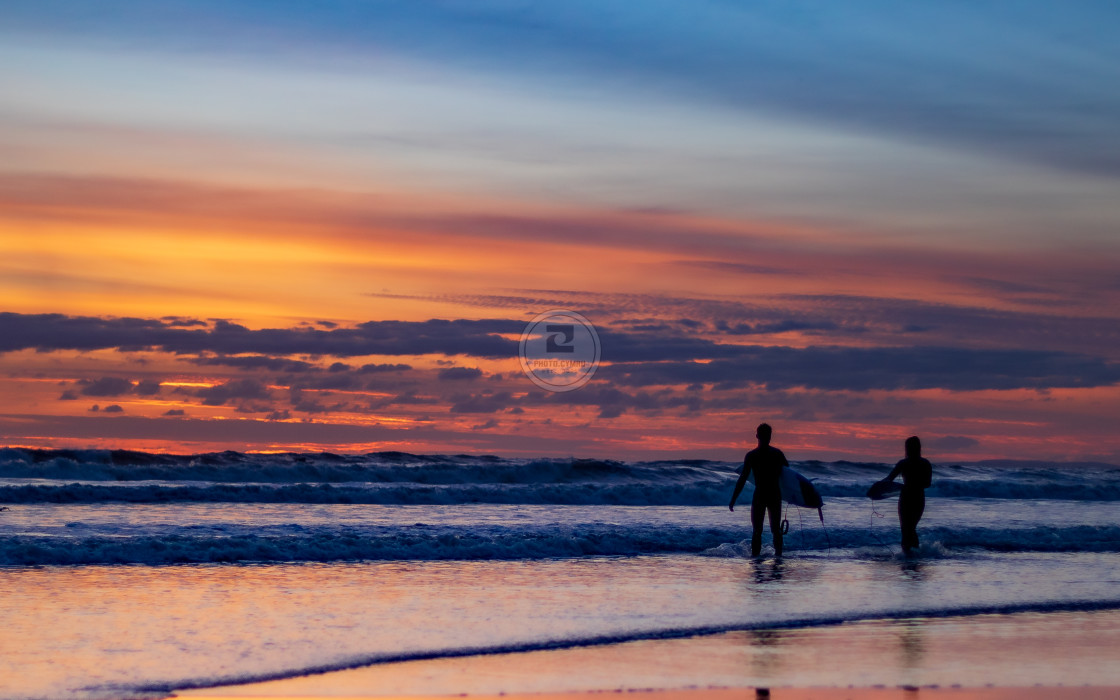 "Heading into the sea at sunset." stock image
