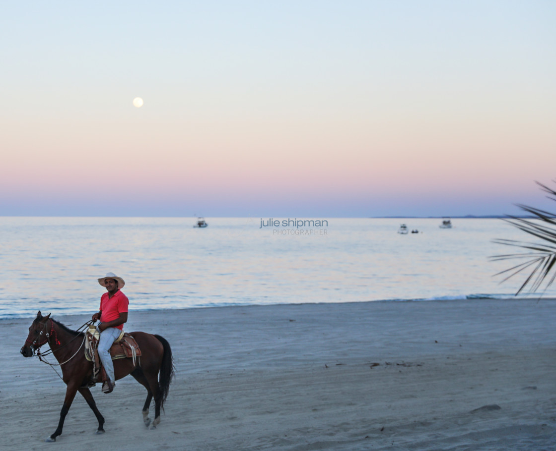 "Riding the Beach at Moonrise" stock image