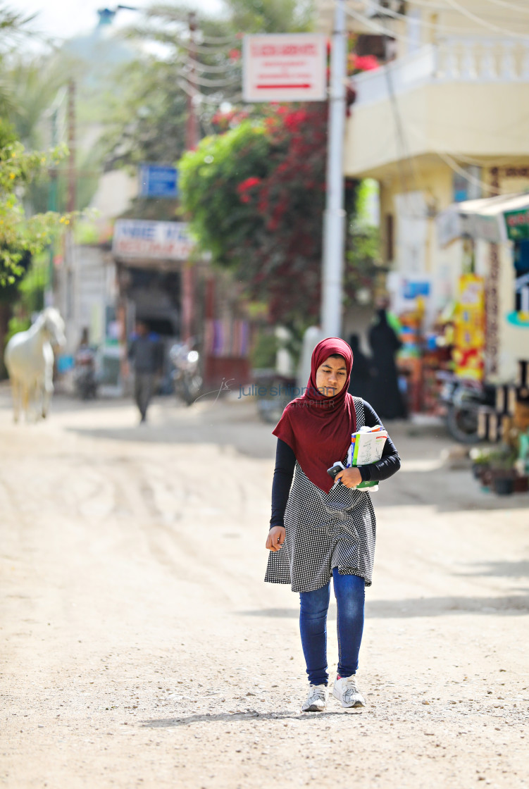 "Young Woman Walks to School" stock image