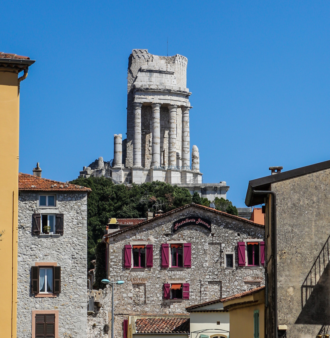 "Roman Ruin over Modern Hostel" stock image