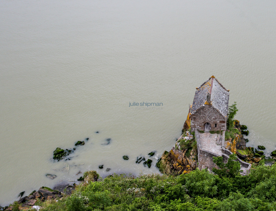 "Looking down on a Small Cottage in the Sea" stock image