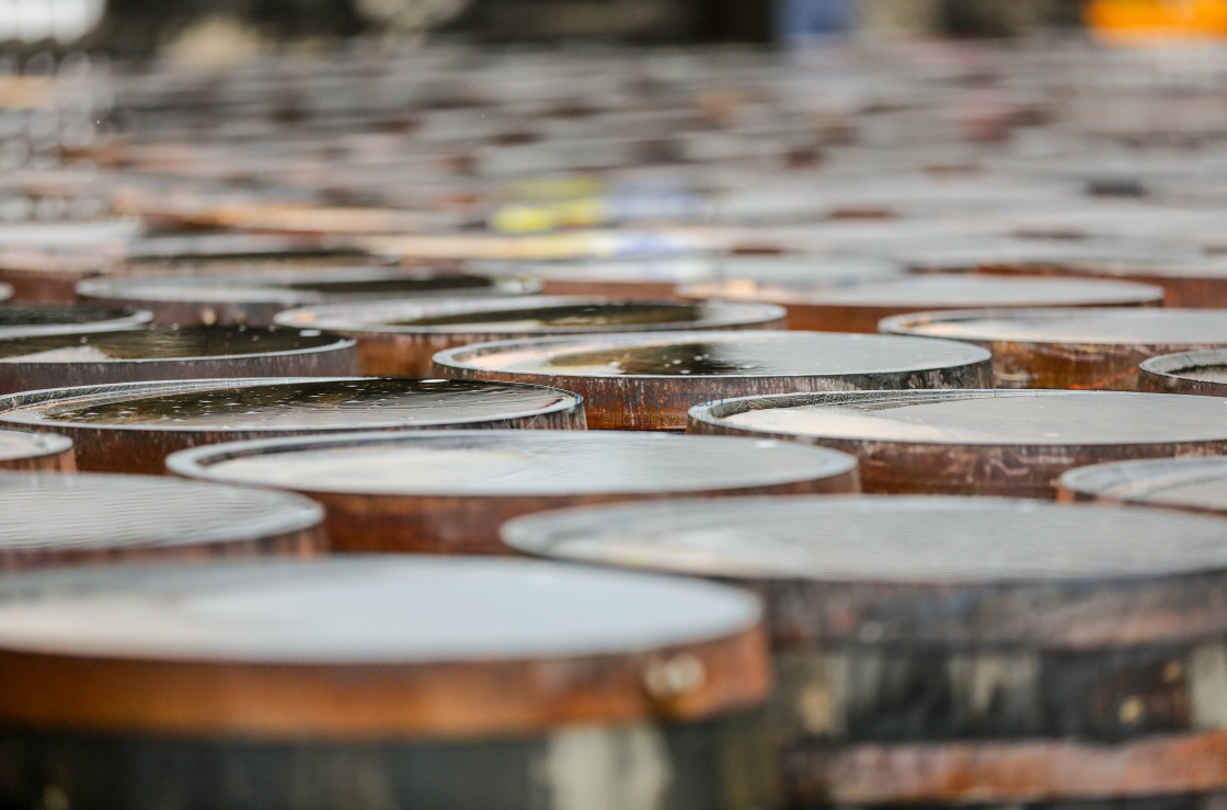 "Puddles in Whiskey Barrels" by Julie Shipman - $18.66 "Puddles in Whiskey Barrels" stock image