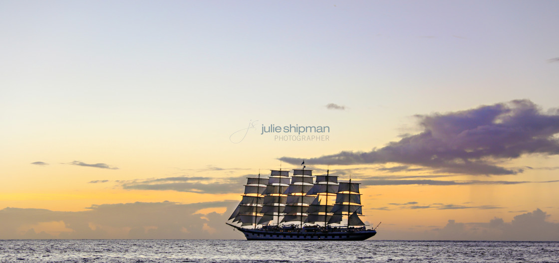 "A five-masted schooner sails at sunset in st. lucia." stock image