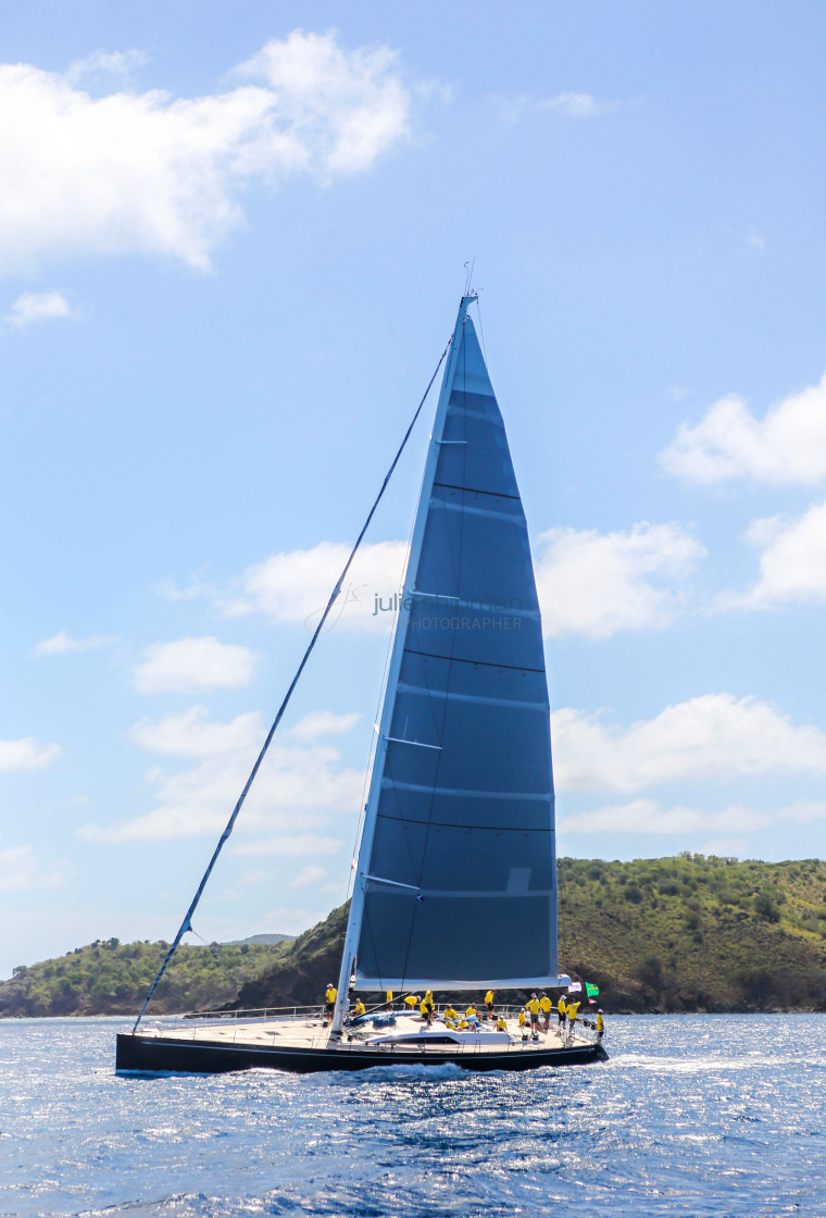 "A racing sailboat speeds by at Virgin Gorda, BVI." stock image