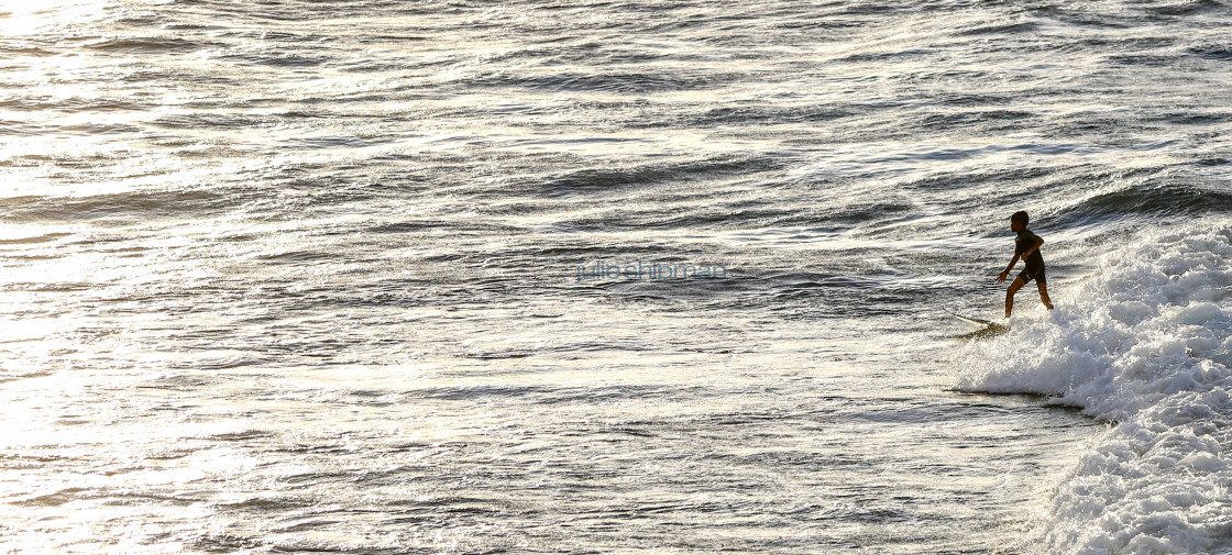 "Young boy in Maui learning to surf." stock image