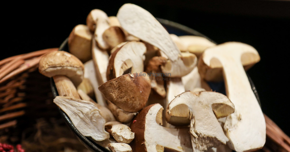 "Freshly sliced mushrooms in a basket." stock image