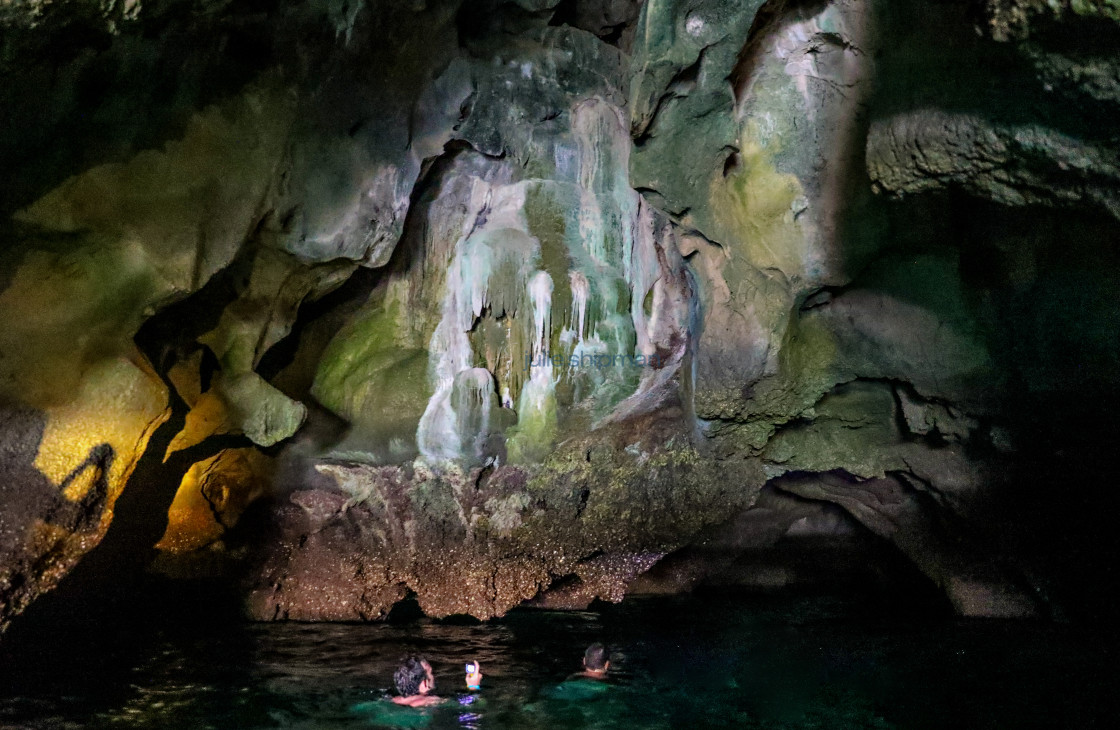 "Swimming in a cave in Thailand." stock image