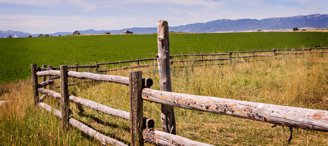 "Old log fence in a field during our adventures on a ranch in Alta, Wyoming, on the west side of the Teton Mountains." stock image