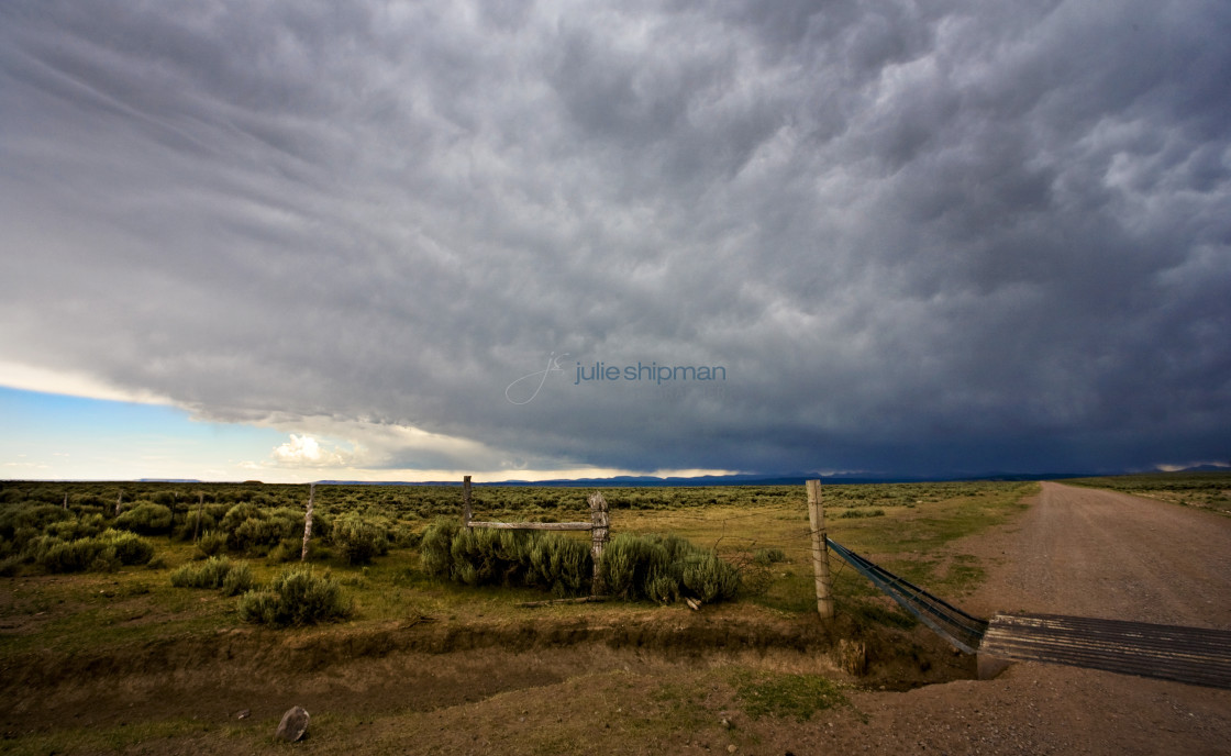 "A storm is coming in over the Uintahs with huge ominus clouds during our adventures of The West in Robertson, Wyoming and the ranches in the Bridger Valley." stock image