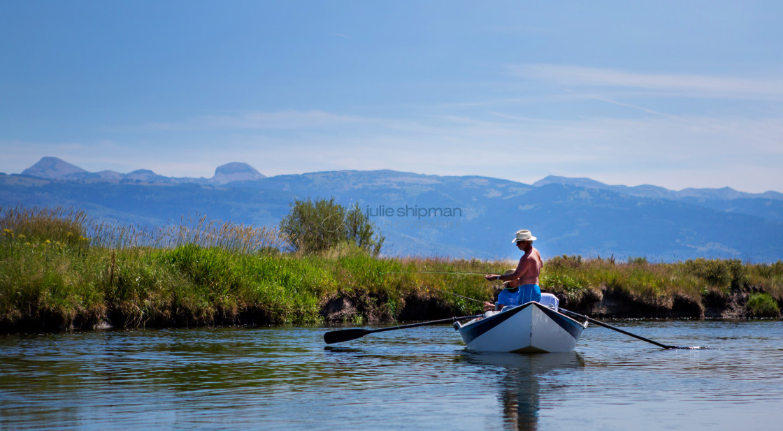 "Fishing on a river in Wyoming, on the west side of the Teton Mountains." stock image