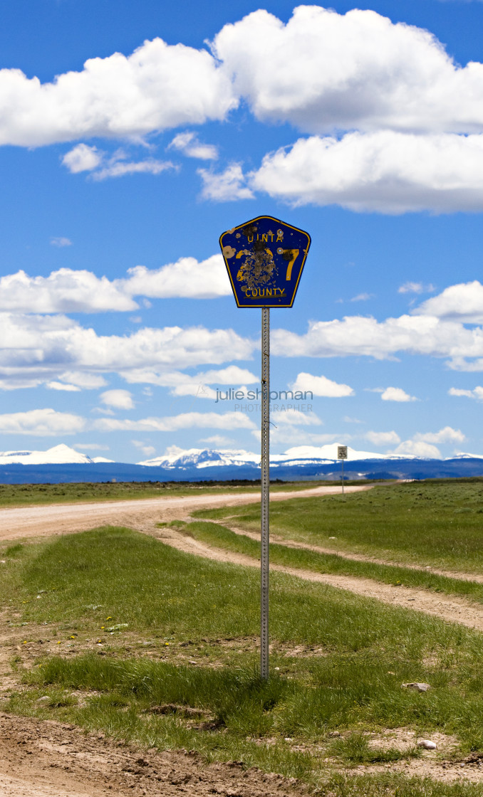 "A road sign full of bullets in Robertson, Wyoming and the ranches in the Bridger Valley." stock image