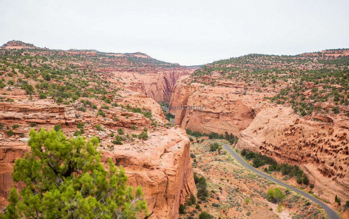 "Scenic road winding its way through red rock formation in Southern Utah just outsidde of Boulder and Capitol Reef." stock image