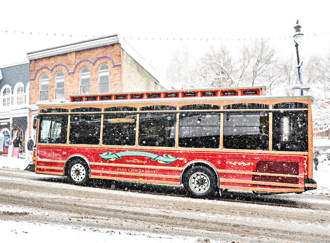 "Old Red Trolley in the winter on Main Street Park City." stock image