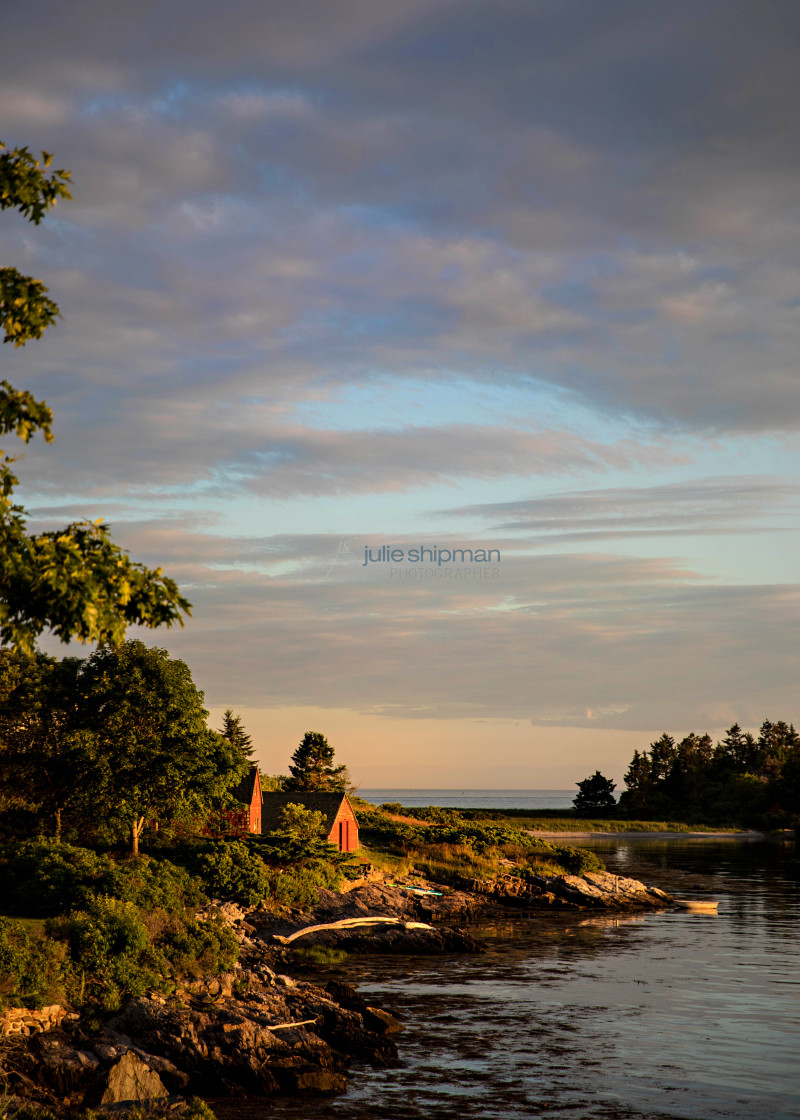 "Old red cottage on the coast in Maine at sunset." stock image