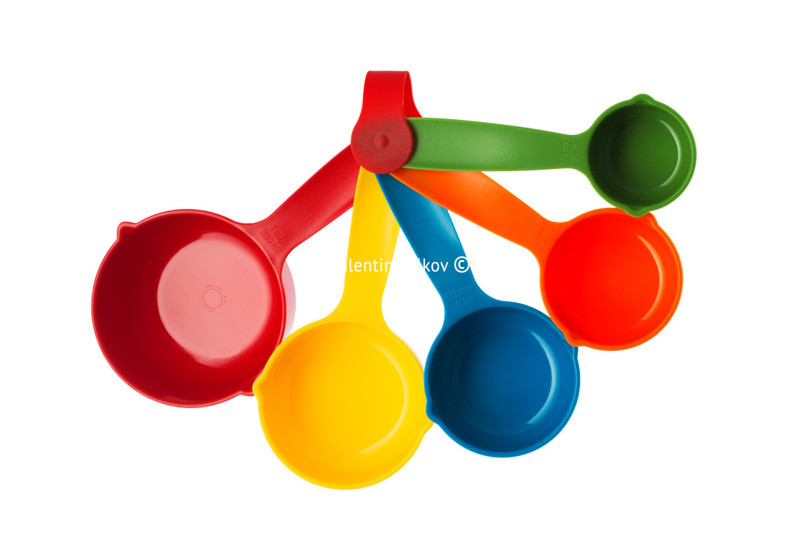 "Color plastic dosing spoons isolated on a white background" stock image