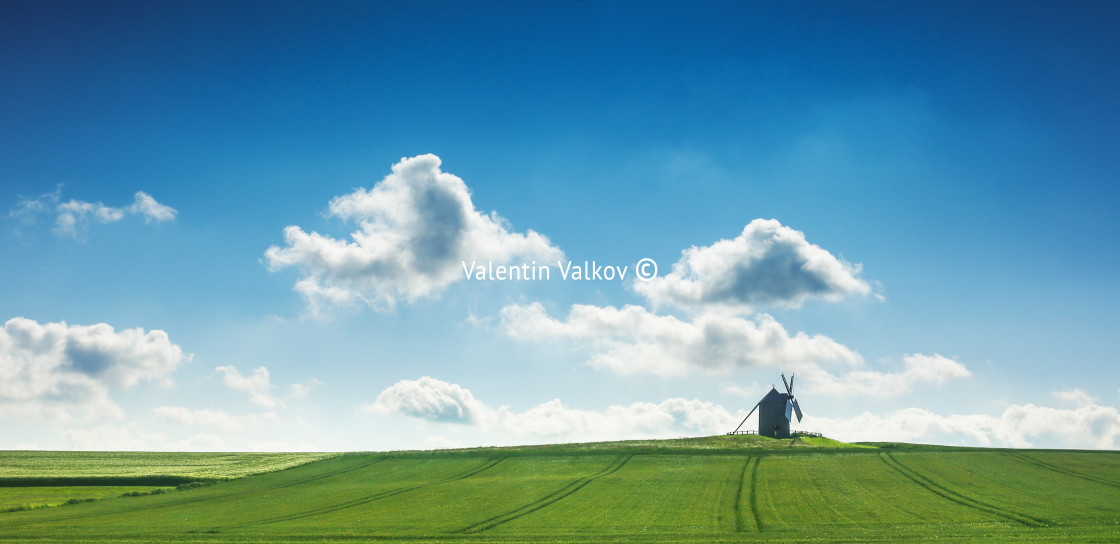 "Old windmill in the field" stock image