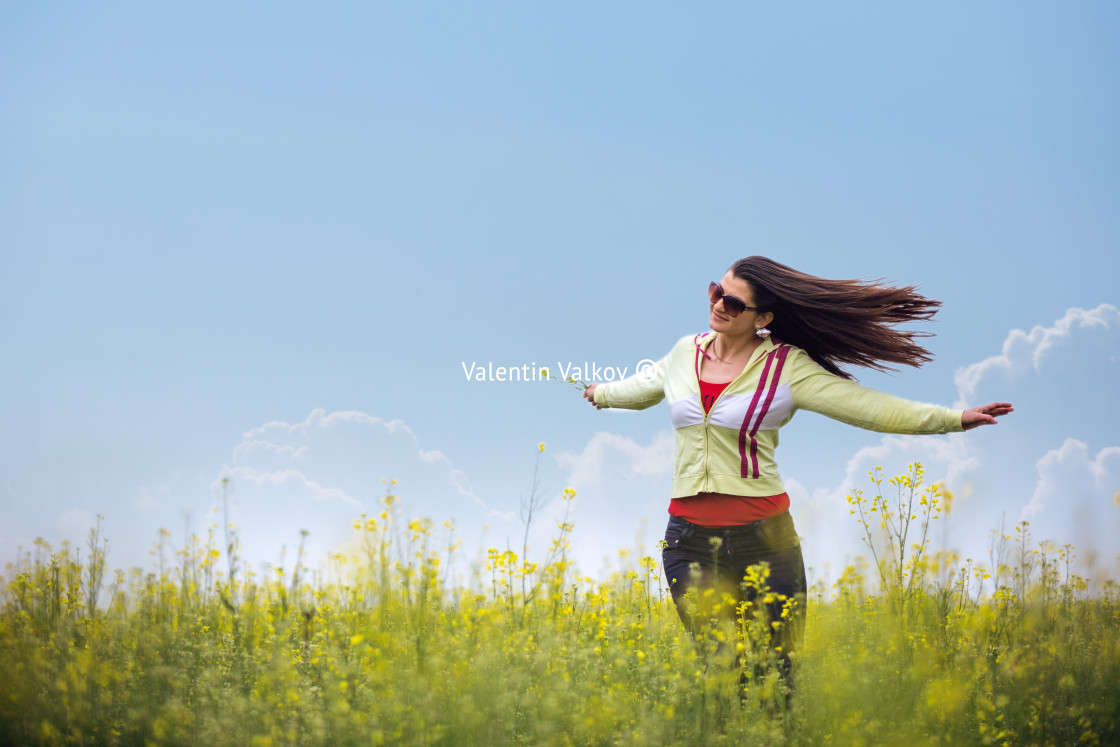 "Beautiful girl enjoying the sunny day in the wheat field" stock image