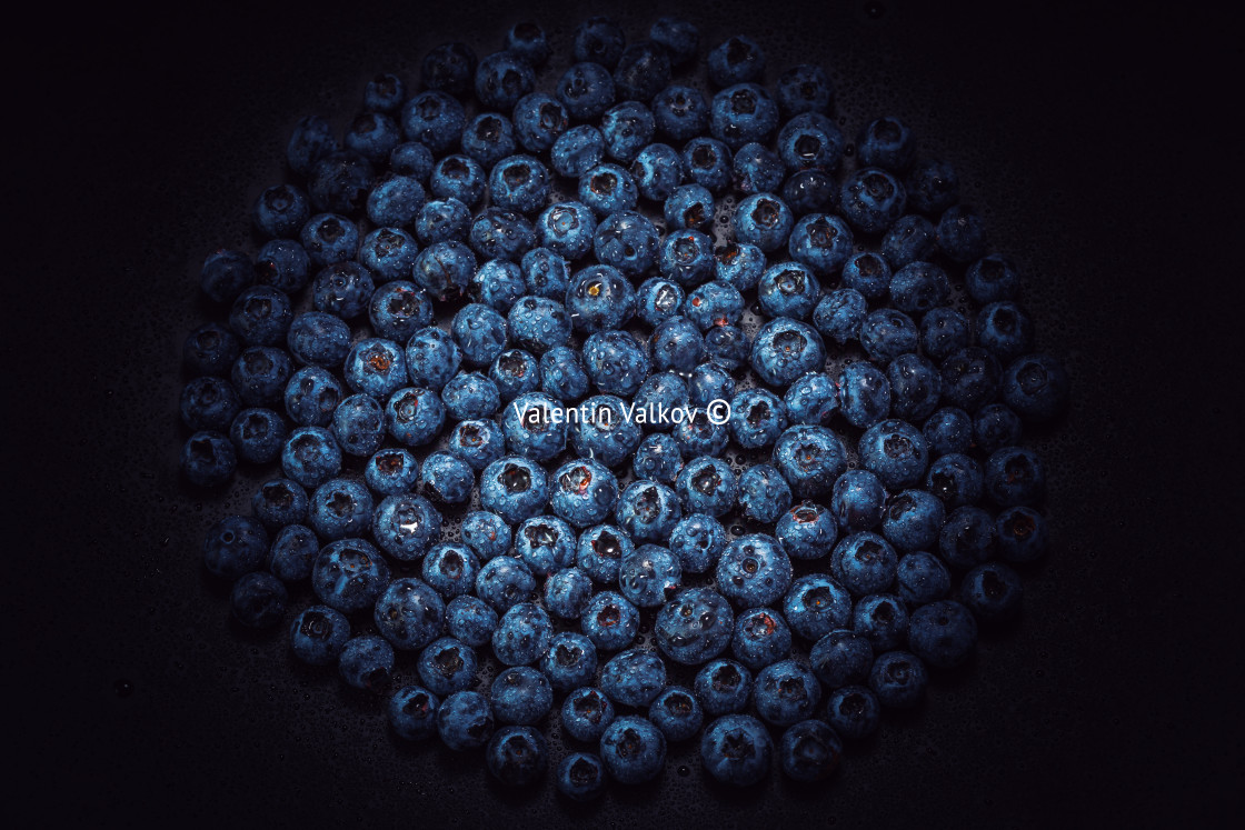 "Wet blueberries on black slate" stock image