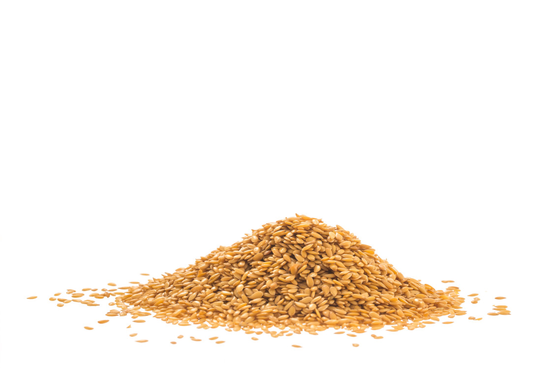 "Pile of golden flax seed or linseed isolated on white background" stock image