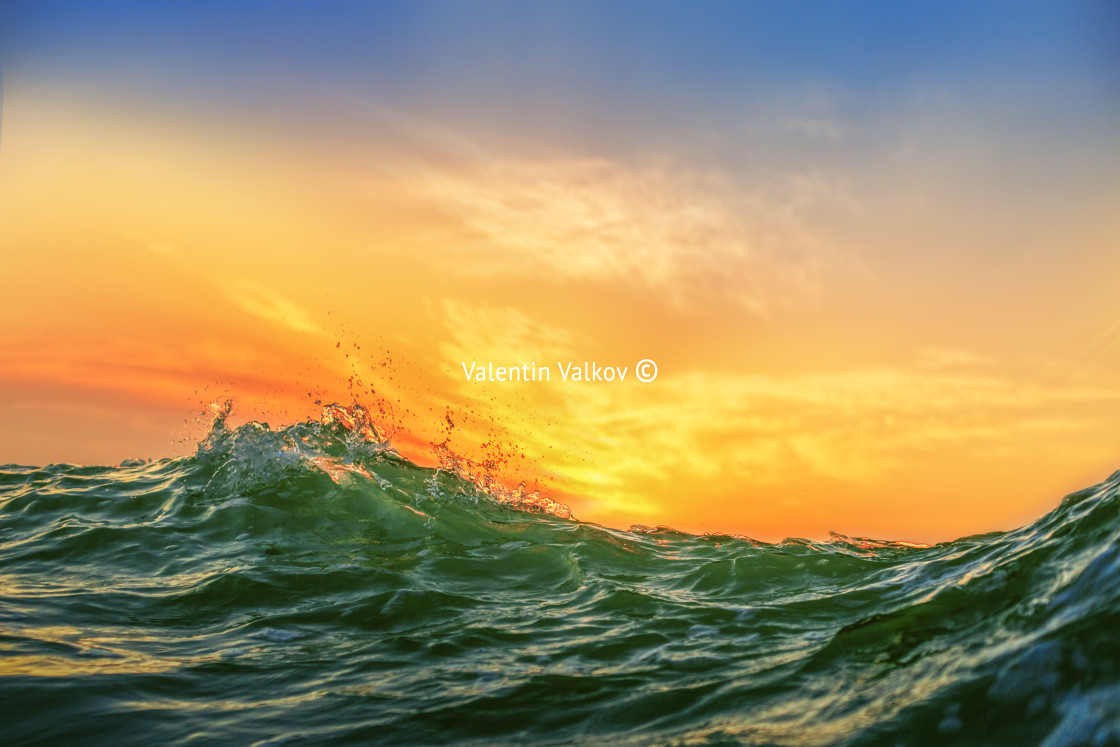 "Sunrise and shining waves in ocean" stock image