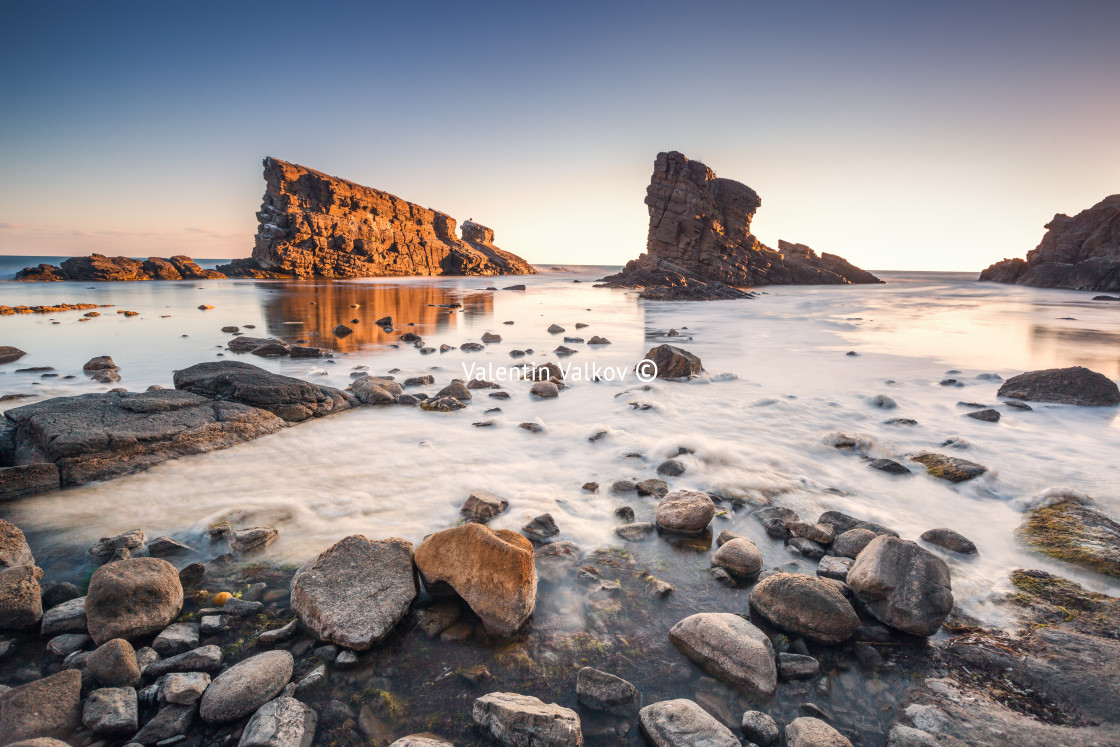 "Dramatic sunrise with mist on the beach with rocks" by Valentin Valkov - $24.48 "Dramatic sunrise with mist on the beach with rocks" stock image