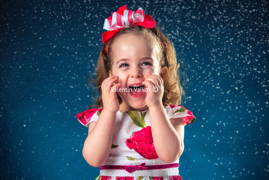 "winter, holidays, christmas concept - beautiful little girl havi" stock image