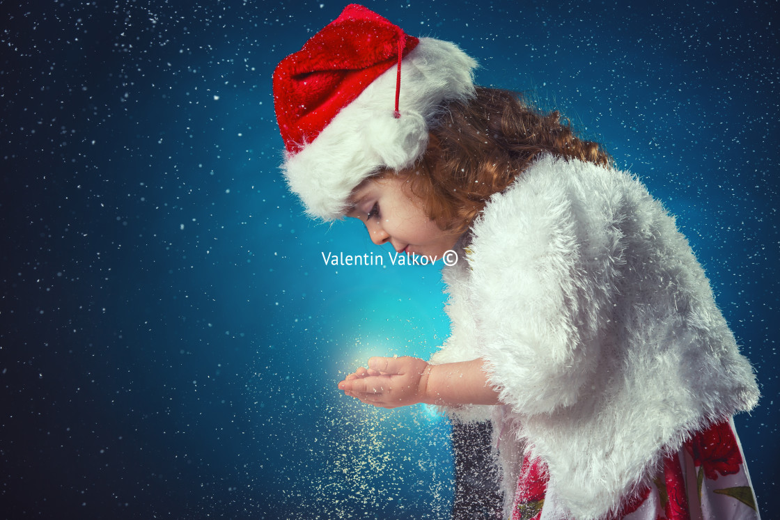 "winter, holidays, christmas concept - beautiful little girl havi" stock image