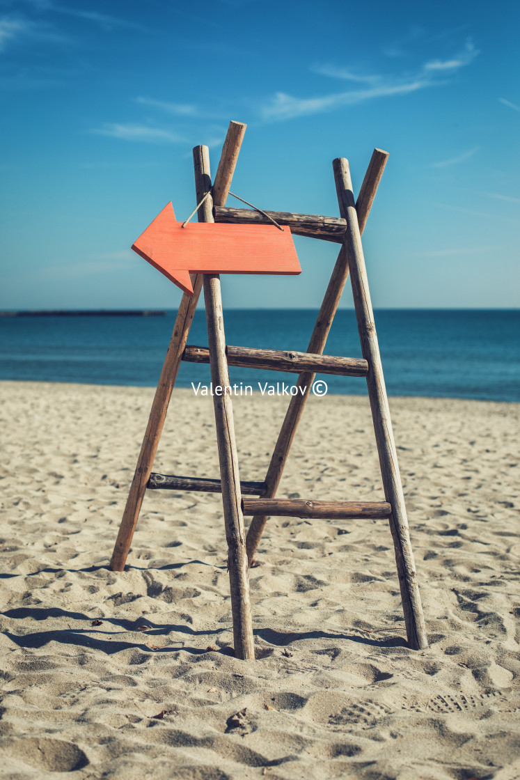 "Wooden handmade signpost on the tropic beach." stock image