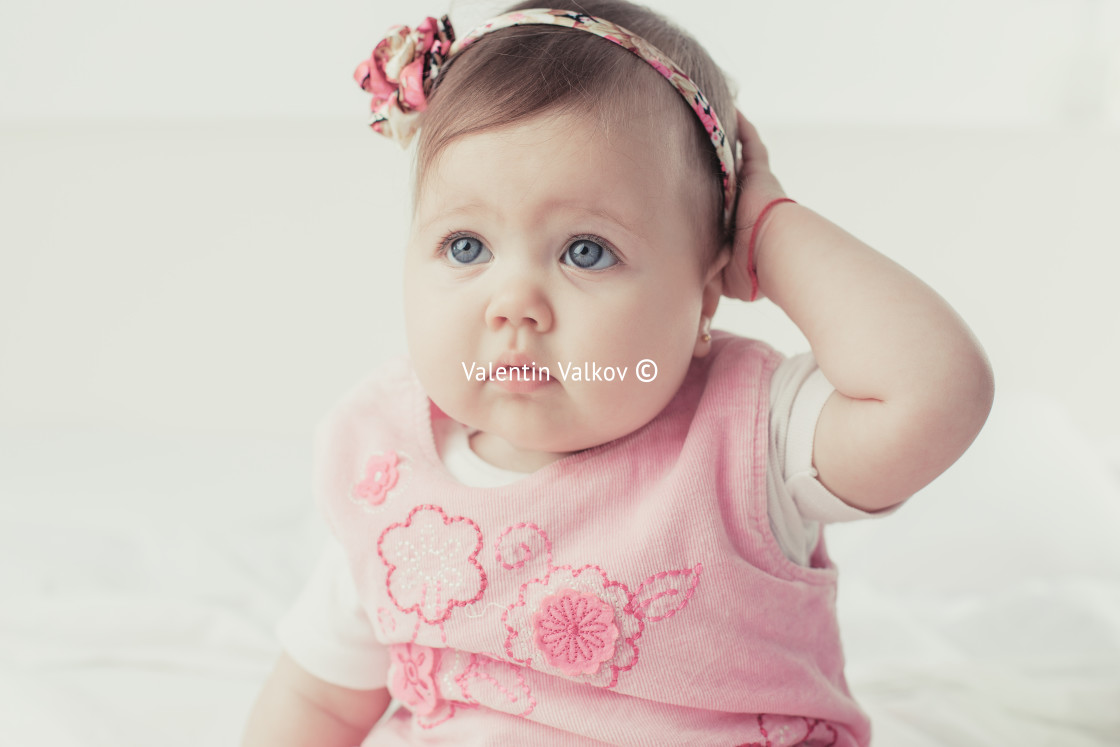 "Adorable baby girl portrait on white background" stock image