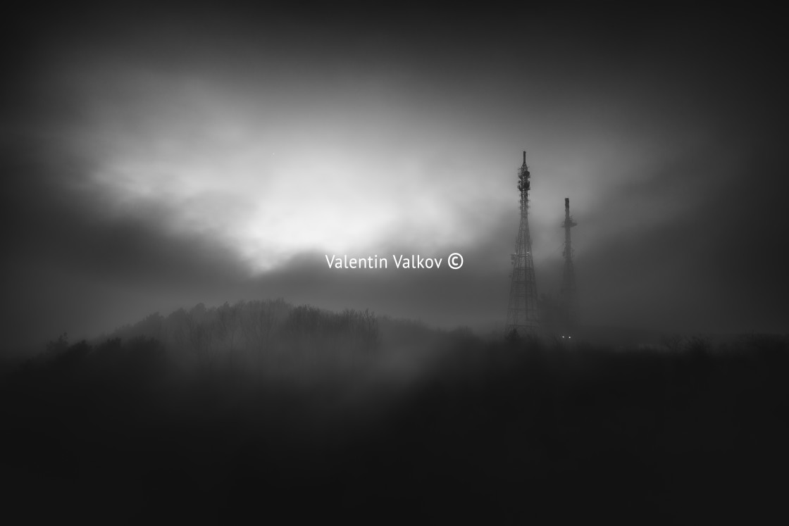 "Misty Fog over connection and radio tower in the mountain" stock image