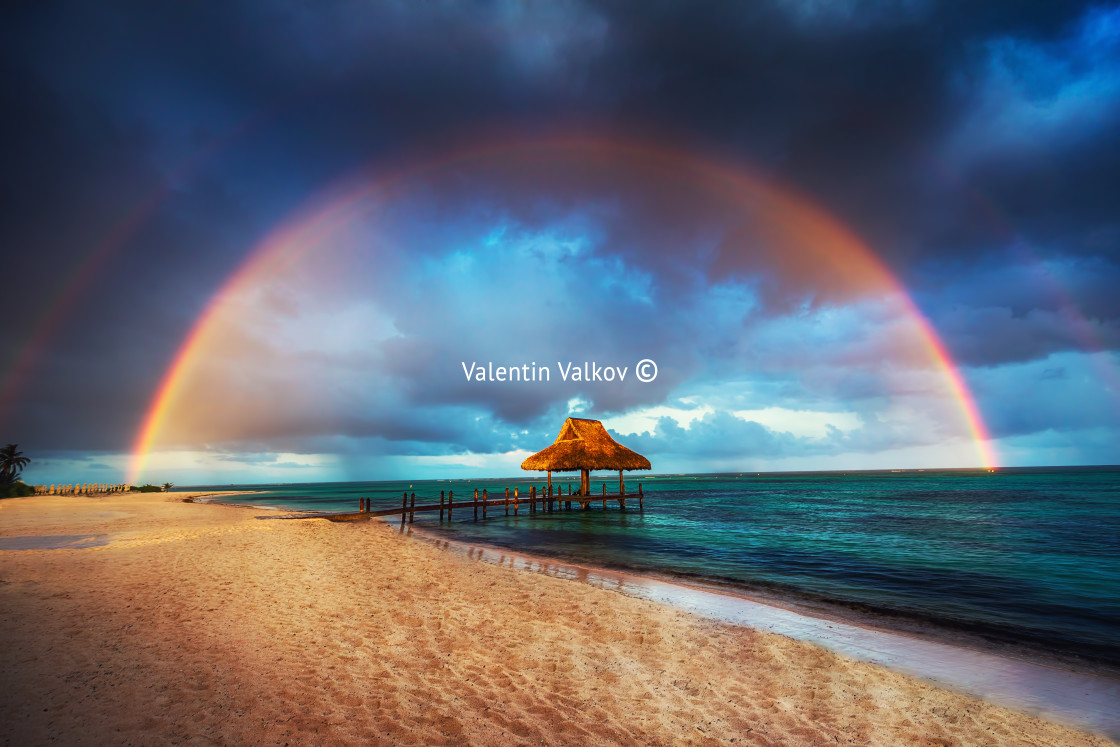 "Rainbow over the Tropical beach in Punta Cana, Dominican Republi" stock image