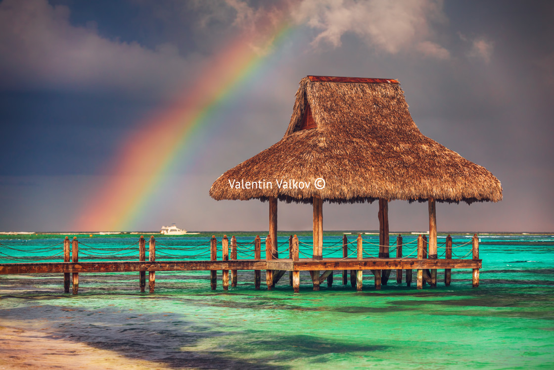 "Rainbow over the Tropical beach in Punta Cana, Dominican Republi" stock image