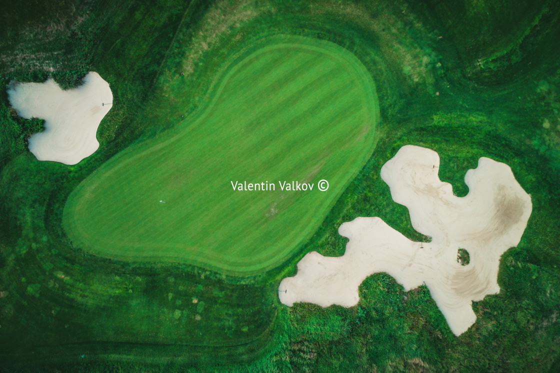 "Golf course in luxury resort aerial drone view" stock image