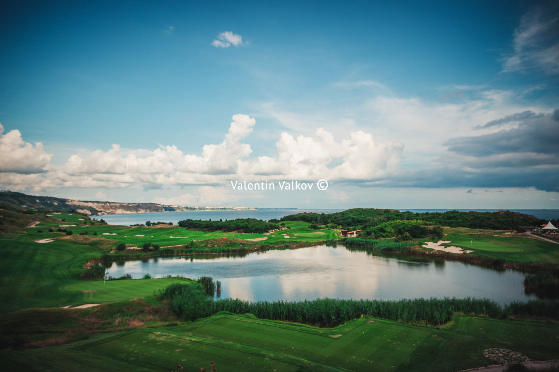 "Golf course in luxury resort with players. Aerial view of golfer" stock image