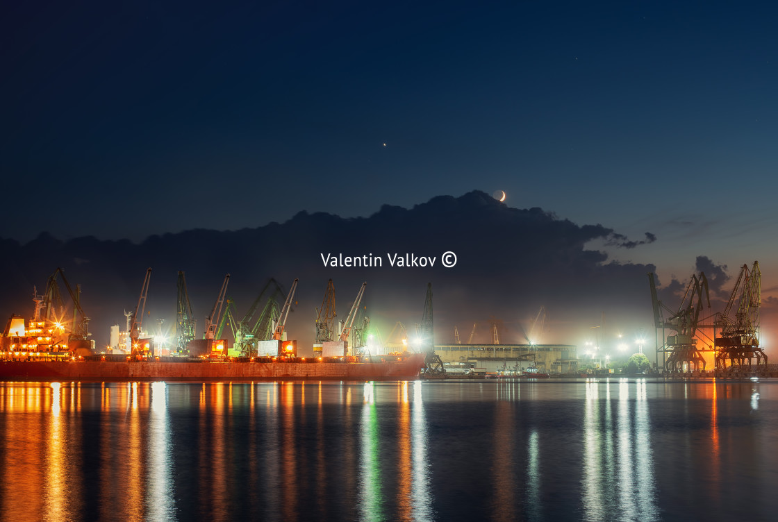 "Industrial cranes and cargo ships in Varna port, Bulgaria at sun" stock image