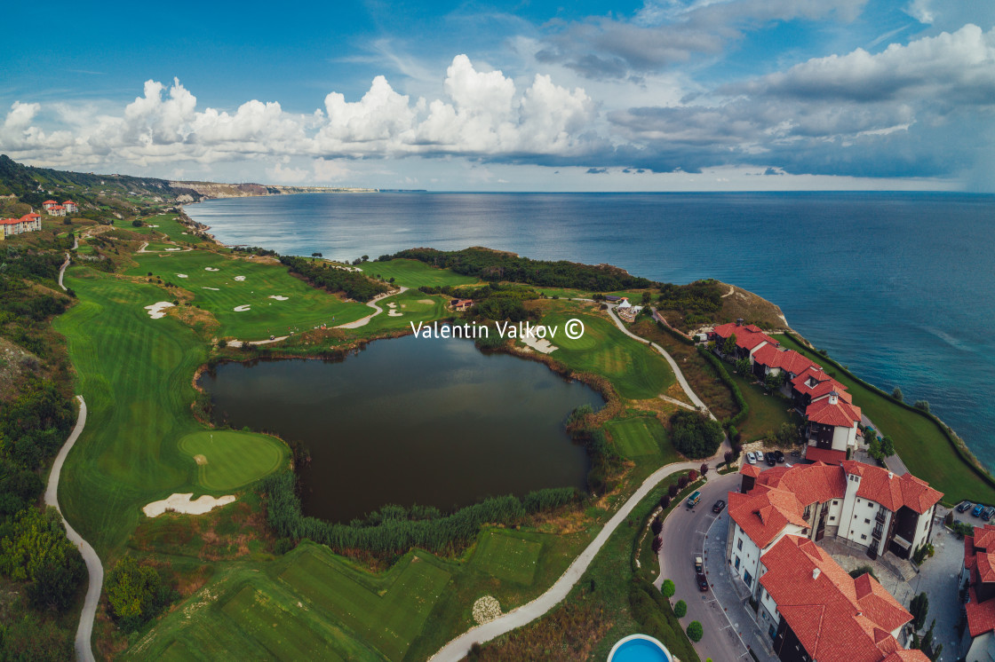 "Golf course in luxury resort next to the sea cliffs. Aerial view" stock image