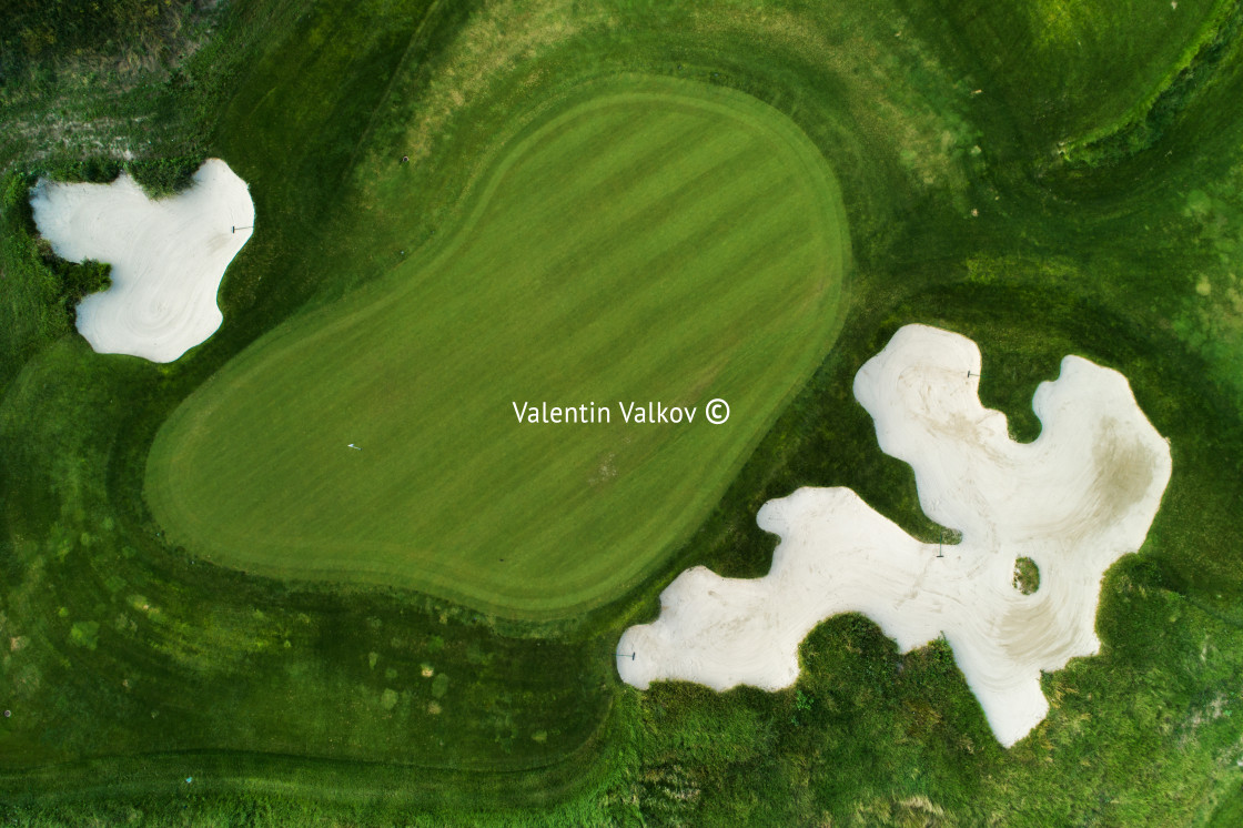 "Golf course in luxury resort aerial drone view" stock image