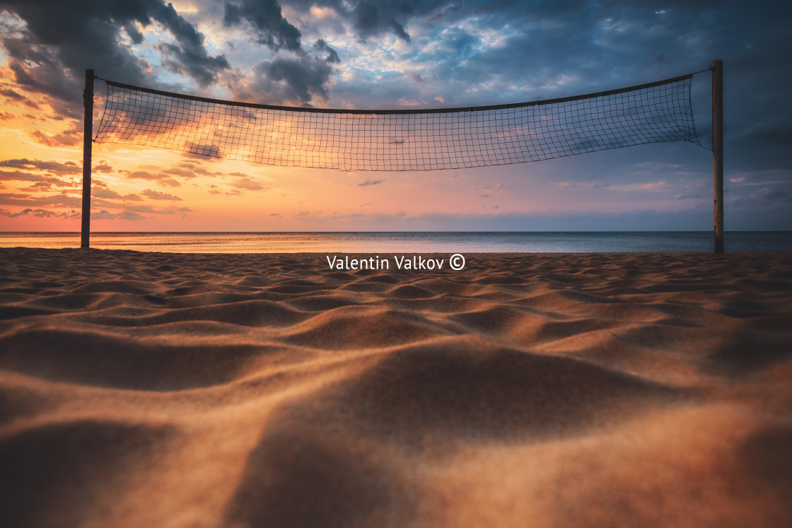 "Volleyball net and sunrise on the beach" stock image