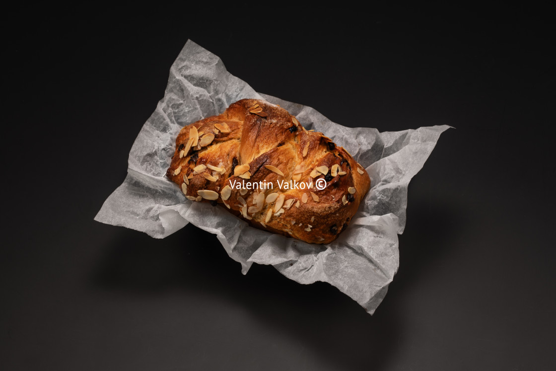 "Freshly baked Easter bread with chocolate and almonds isolated" stock image