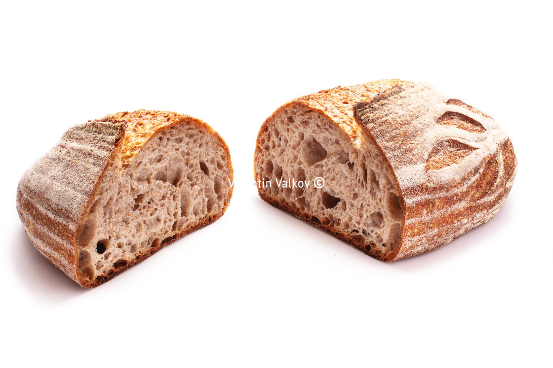 "Whole wheat sourdough freshly baked bread on white background." stock image