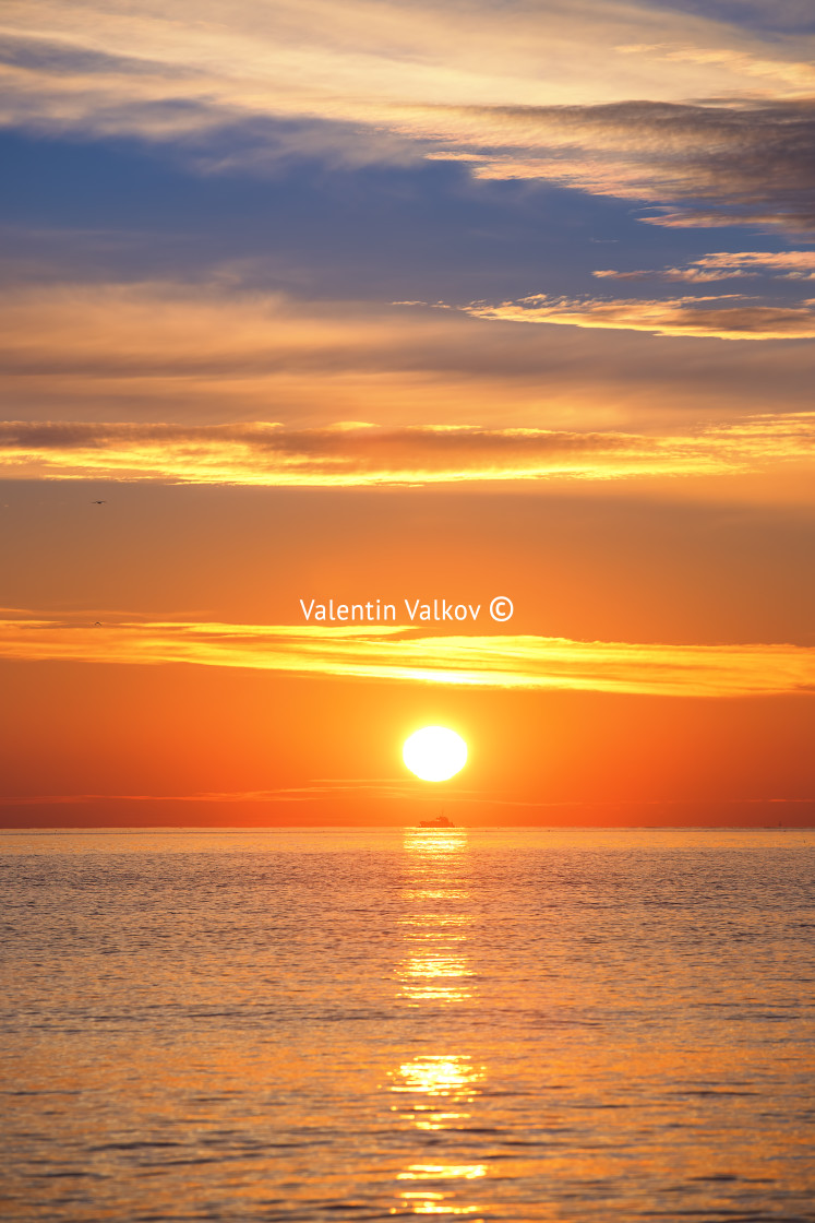 "Sunrise over the sea with sailing cargo ship,. Transportation. L" stock image