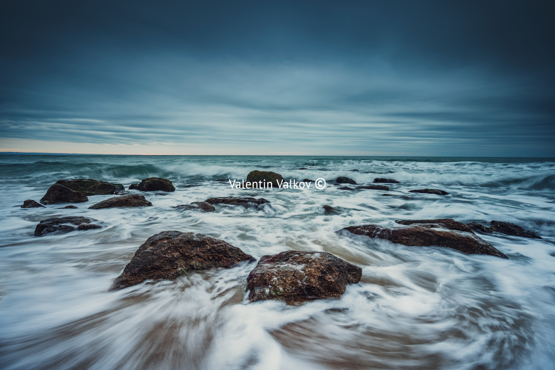 "Cloudy sunrise over the beach" stock image