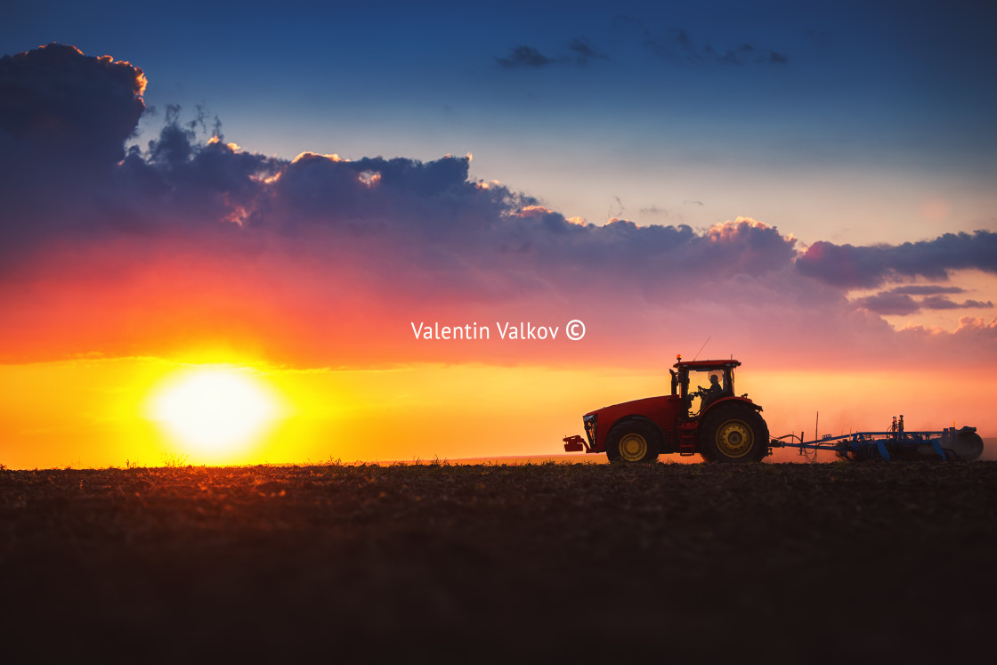 "Farmer in tractor preparing land with seedbed cultivator" stock image