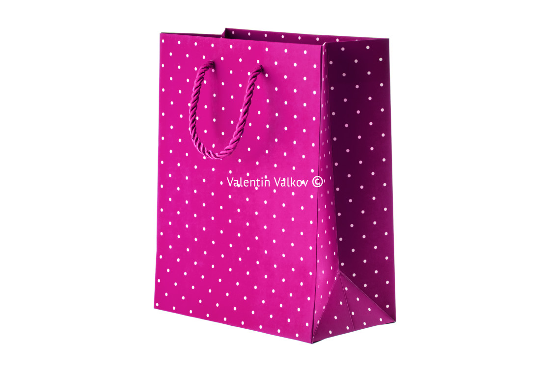 "Pink paper bag on white background" stock image