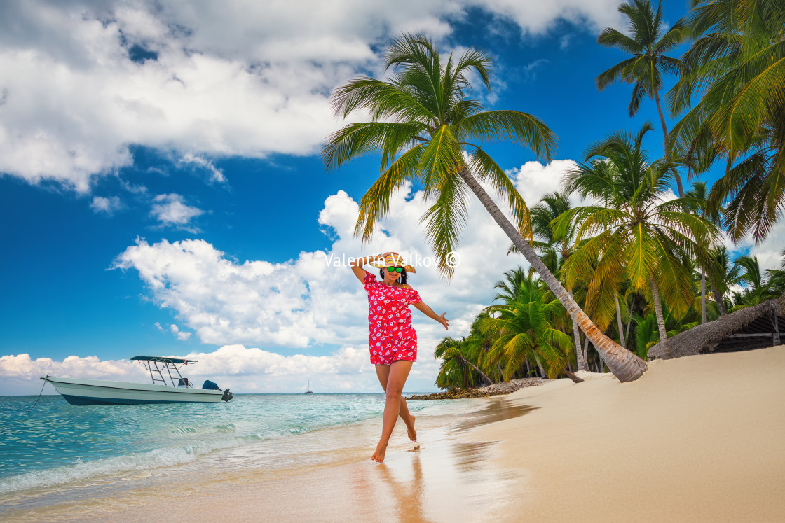 "Carefree young woman relaxing on tropical beach" stock image