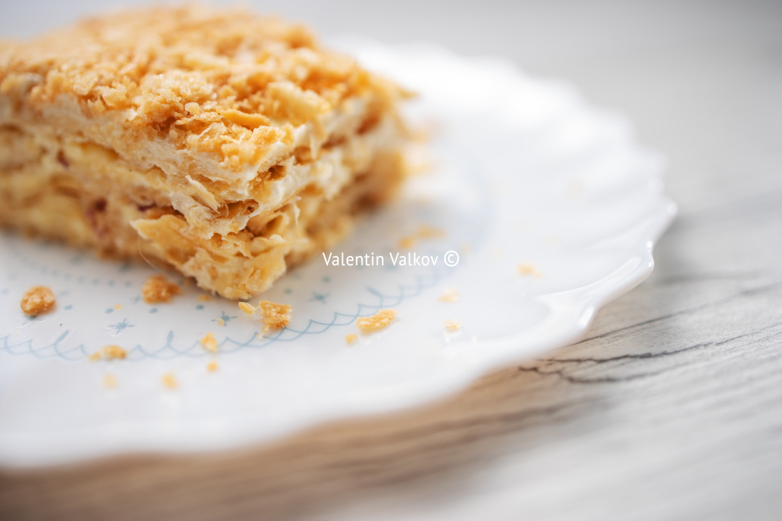 "cake with vanilla milk cream on a plate isolated on white backgr" stock image