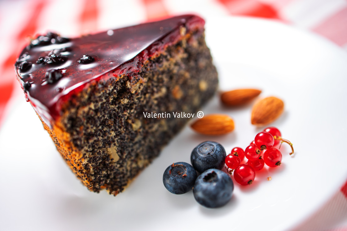 "Cake with berry fruits, chia cereals and nuts in a plate" stock image