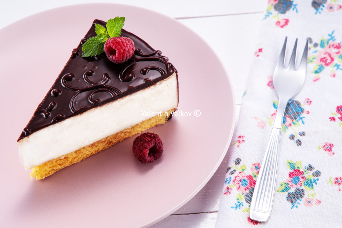 "Chocolate cake with decoration and fruits in a plate with fork" stock image